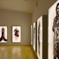 AES+F, "Defile", 2000-2007, series of digital collages, 7 lightboxes, 205x106x20cm. Courtesy of the artists, MAC, Moscow, and Triumph Gallery, Moscow