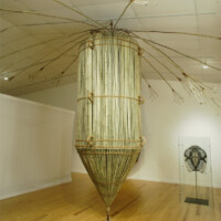 Mel Chin - Do Not Ask Me, "OUR STRANGE FLOWER OF DEMOCRACY" - Stuck on an island we worship the cargo of democracy. We send it over as a dumb-bomb (BLU-82) fueling fear and apprehension. Bamboo, jute, sisal, coir, exotic hardwood, 2005