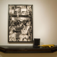 James Drake, "M – 16", 1990, steel, charcoal on paper, gold leaf, shelf: 120” x 60” x 20”, drawing: 66’ x 44” (on the shelf) "Golden Gun", 1997, steel, gold leaf, 33” x 12’ x 3”